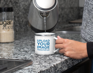 Mockup of a Woman Pouring Water into a 12 oz Enamel Mug 30835a