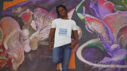 T-Shirt Video of a Tall Man Posing in Front of an Urban Mural 3430v