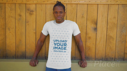 T-Shirt Video of a Man Posing by a Wooden Fence 3396v