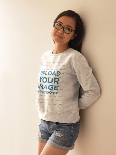 Placeit Asian Woman Wearing a Crew Neck Sweatshirt Template While