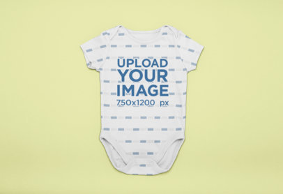 Onesie Mockup over a Solid Surface 25127
