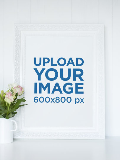 Mockup of a Picture Frame Placed by a Mug with Flowers 597-el
