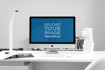 Mockup of an iMac Placed on a White Desk 2142-el