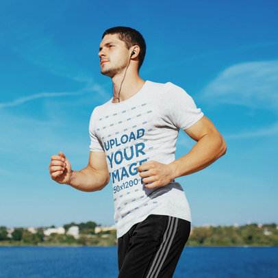 Download Placeit T Shirt Mockup Of A Young Man Running By A Lake