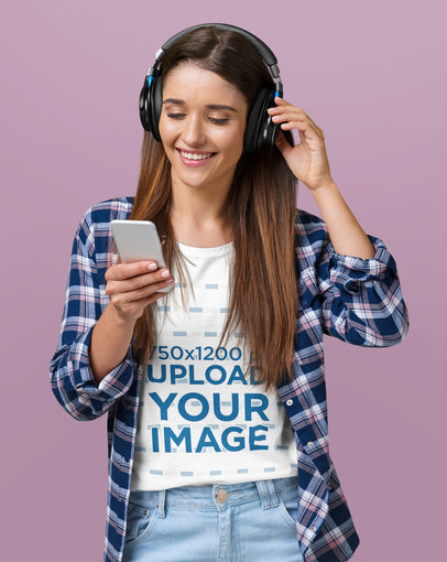 T-Shirt Mockup of a Happy Woman Wearing Headphones to Listen to Music