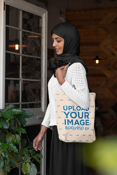 Tote Bag Mockup Featuring an Elegant Woman in a Hijab 32385a