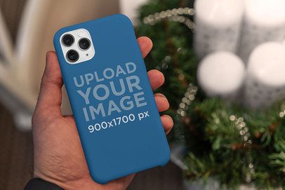 Christmas-Themed Mockup of a Man Holding a Phone Case 5173-el1